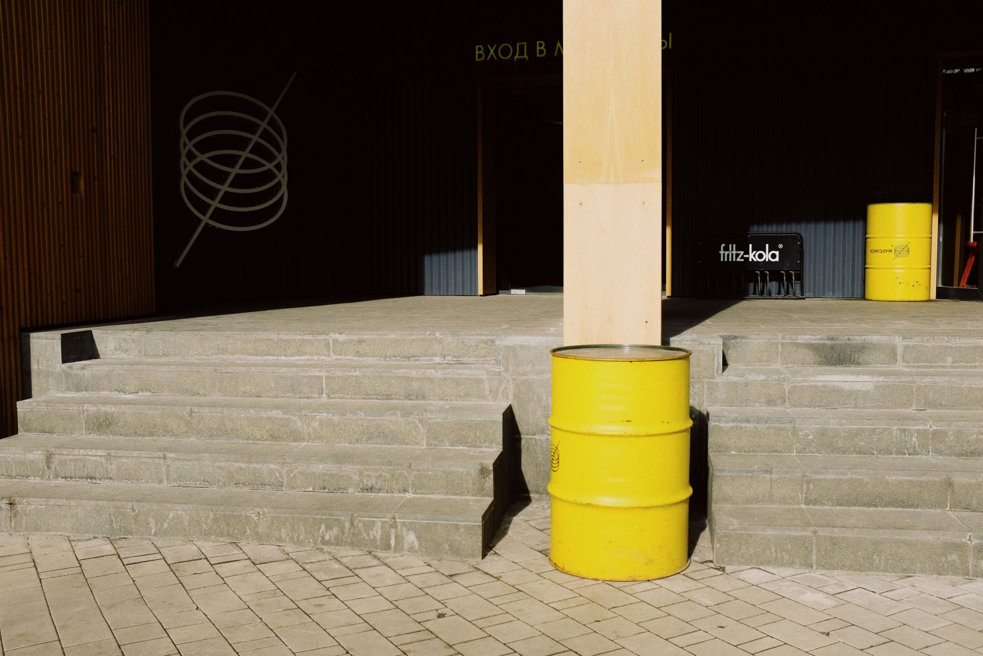 yellow-steel-drum-beside-concrete-wall-3964739.jpg